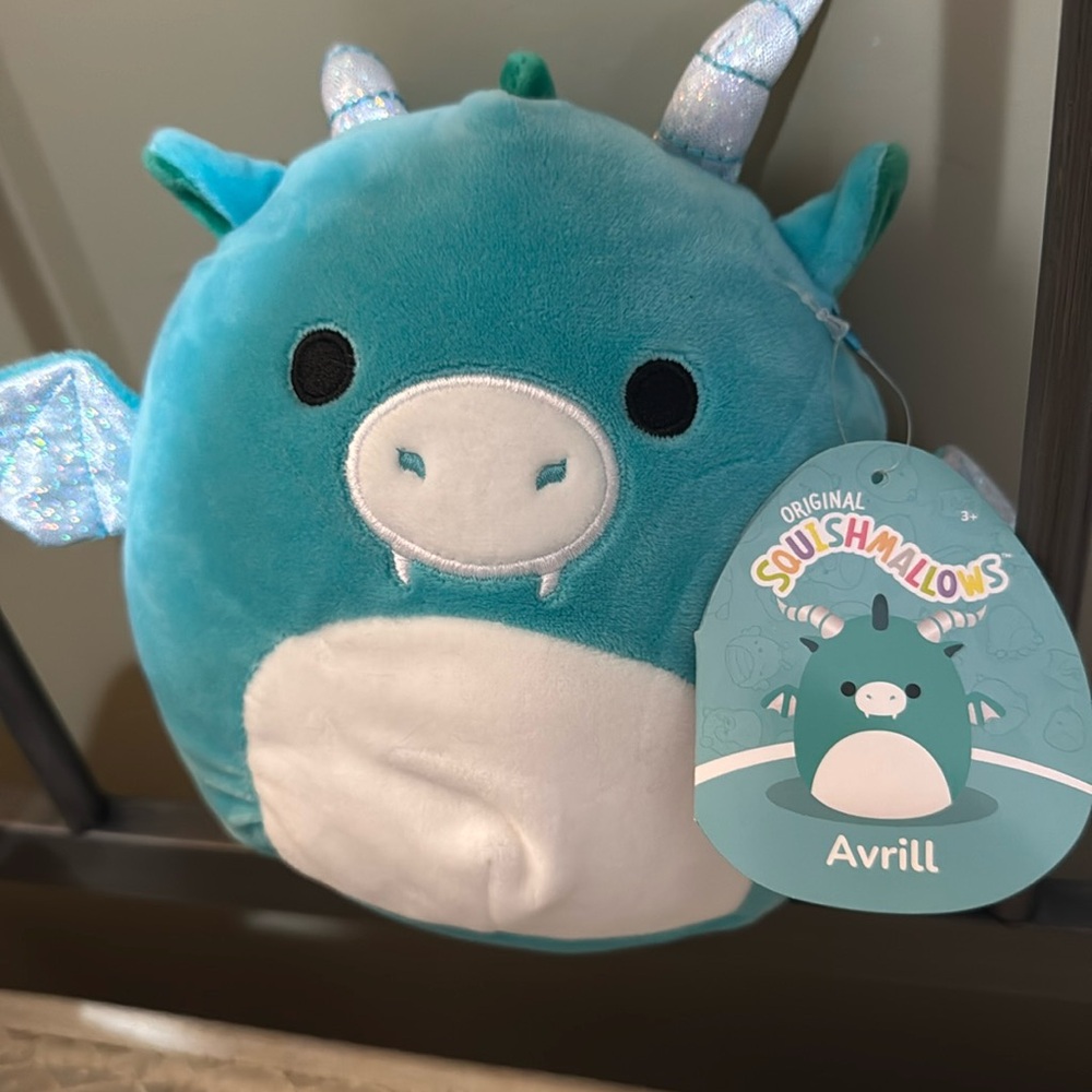 Blue dragon squishmallow named Avrill